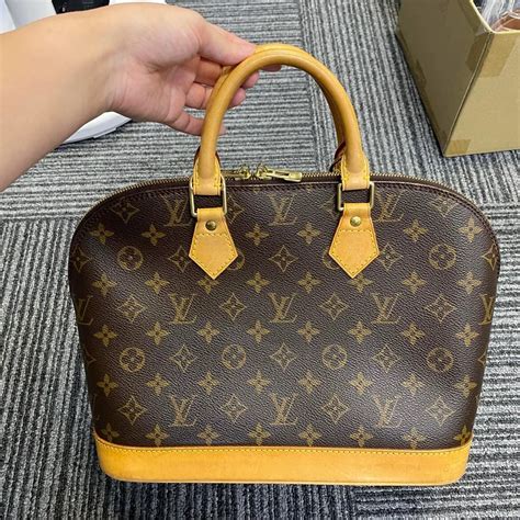 louis vuitton alma fake|false louis vuitton prints.